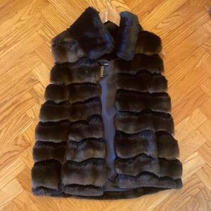 Fur vest from aqua with snaps to close and black fur collar